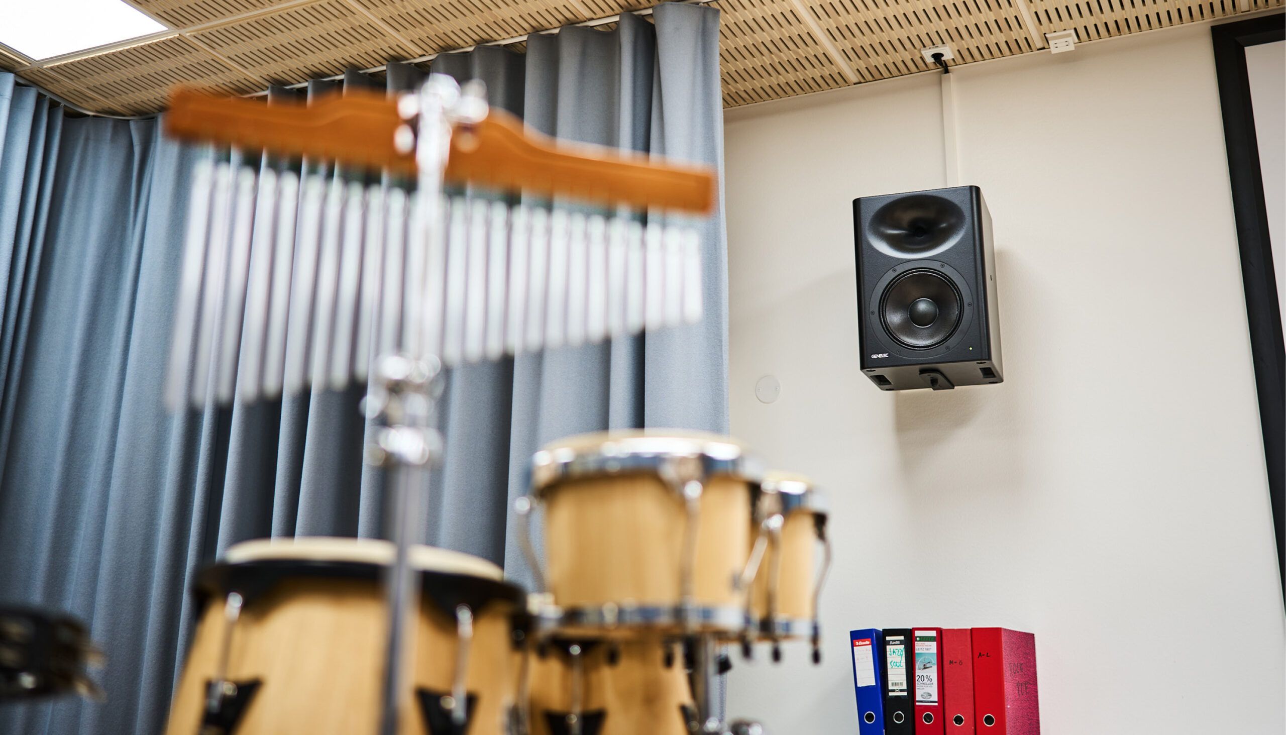 performing arts school music classroom with a drum kit and speaker