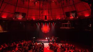 inside circus venue with red lighting