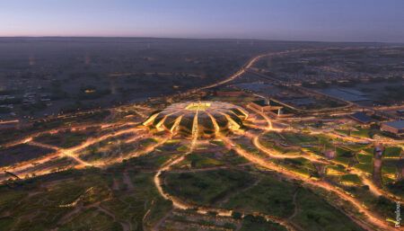 stadium masterplan at night with illuminated roads extending from it