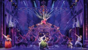 Elaborate musical theatre scene with ornate set piece