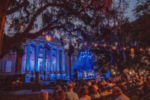2025 Spoleto Festival building illuminated at night with audience