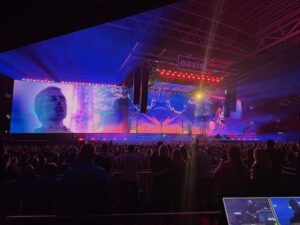 Giant LED screens at Oasis Live '25 concert with crowds
