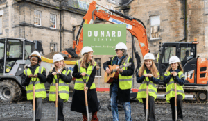 Children and musician with shovels at Dunard Centre groundbreaking