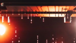 Luminous Hydra-Storm rain machine with water droplets falling