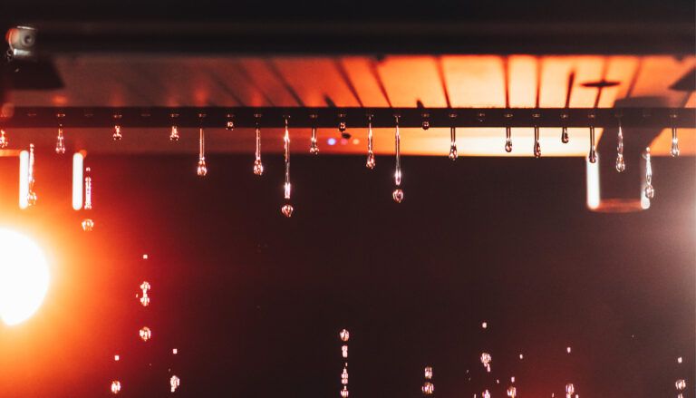 Luminous Hydra-Storm rain machine with water droplets falling